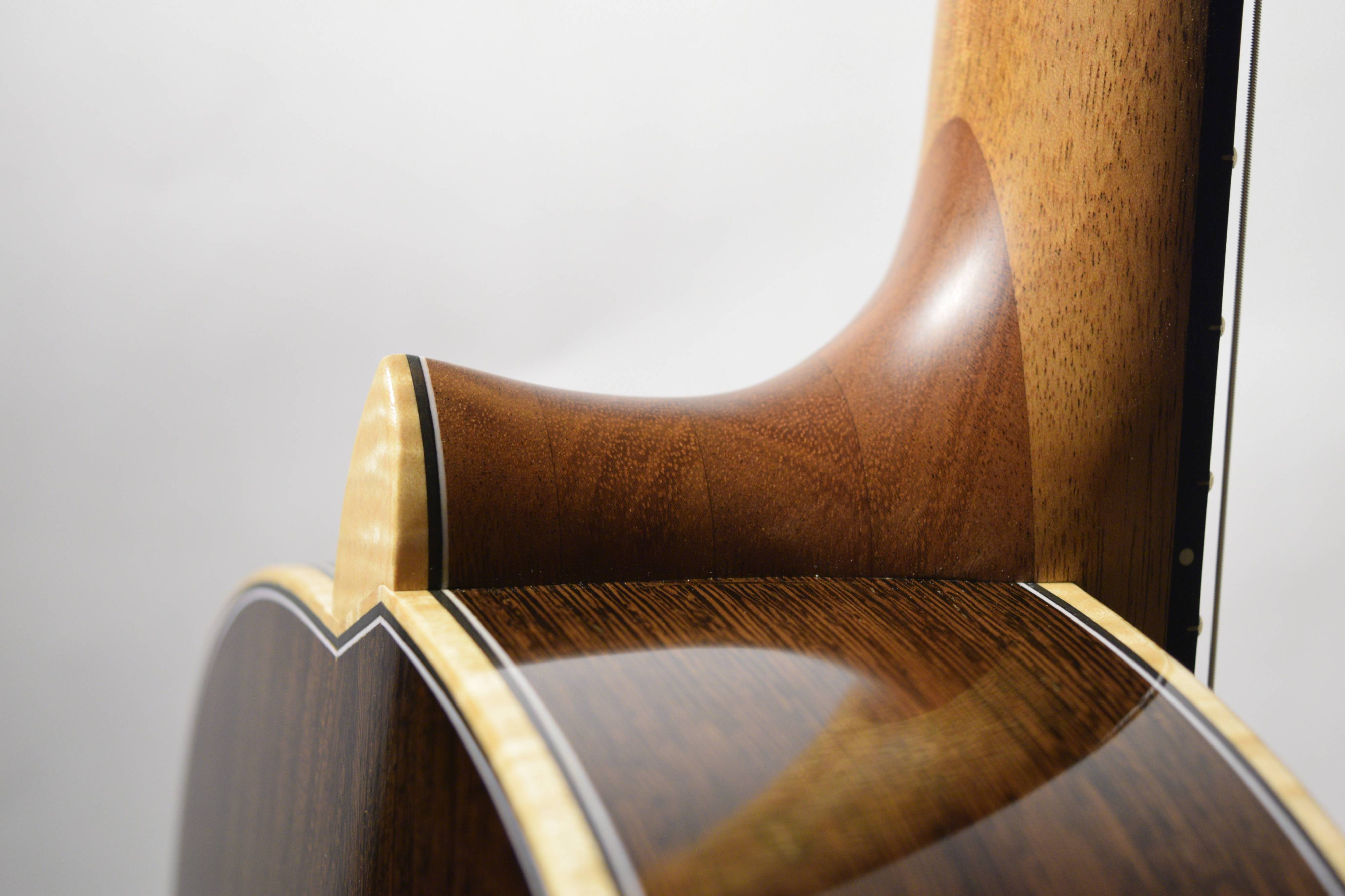 Moving the neck up 10mm to create a 630 scale without changing body shape and brace layout is easier said than done