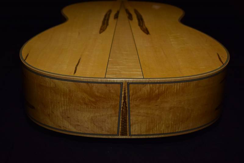 A bookmatched piece of ambrosia maple as the center wedge