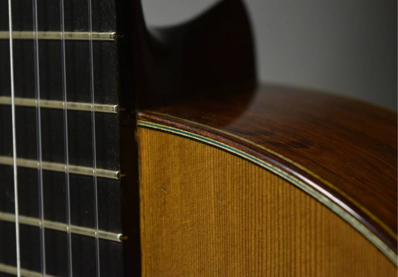 The fretboard has been resurfaced for playability yet the original frets have been kept intact.