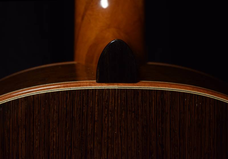 Ebony heel cap and white black white purfling for the back and sides