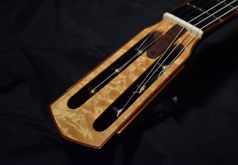 Headstock Rosewood binding and snakewood truss rod cover