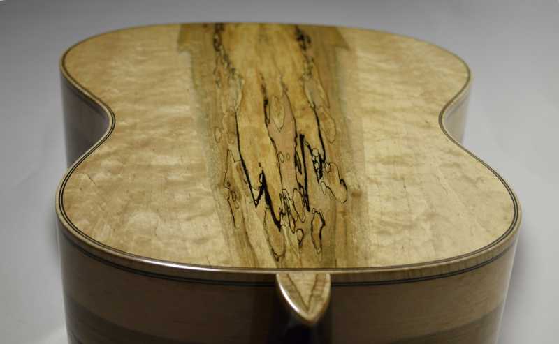 The heal cap has a book-matched, ambrosia maple inlay