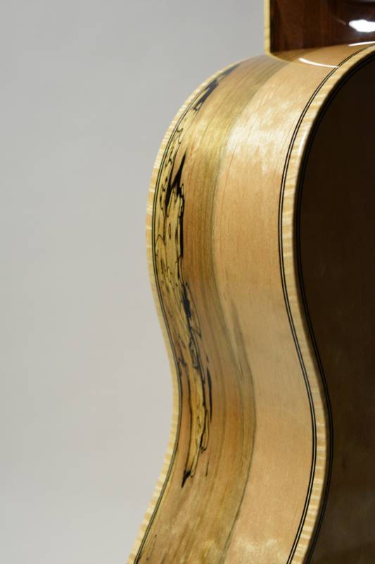 I have always used tiger maple binding - an influence from working at Gallagher Guitar Co